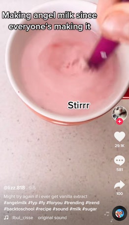 Stirring in food coloring in is one way to make TikTok's angel milk drink. 