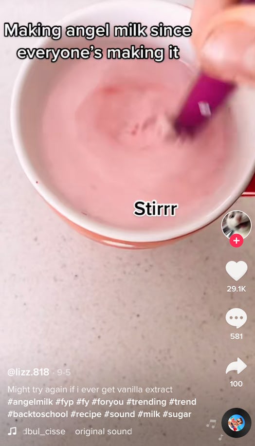 Stirring in food coloring in is one way to make TikTok's angel milk drink. 