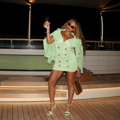 Beyoncé raising a glass on a yacht
