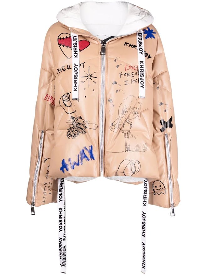 Graffiti-print oversize cropped leather puffer jacket from Khrisjoy, available to shop via Farfeth.