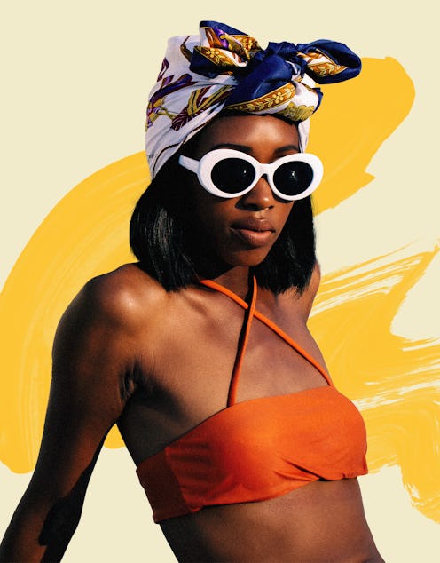 A woman with self-tanner applied on her skin wearing an orange bikini, sunglasses and a scarf wrappe...