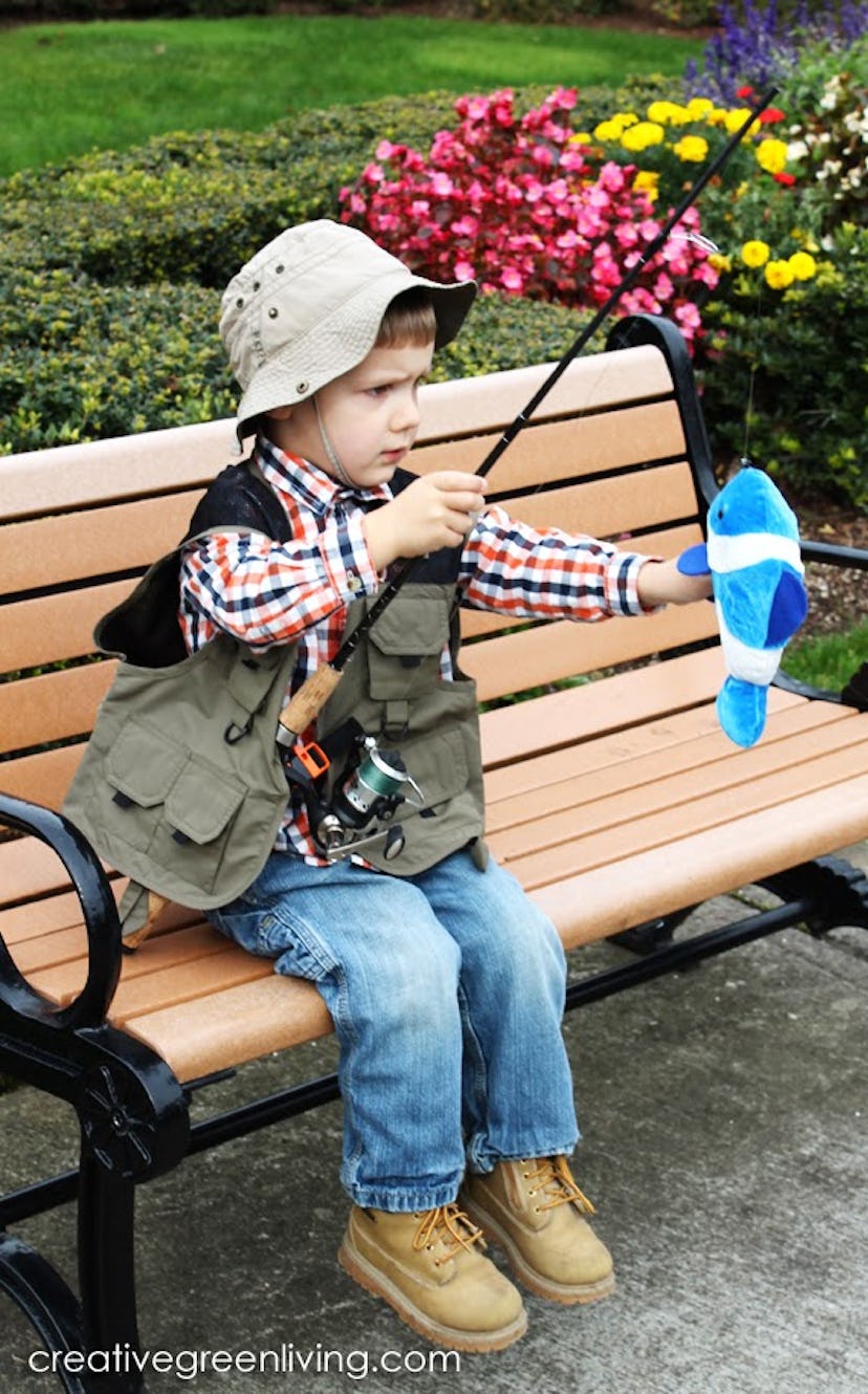 Little boy on a bench, dressed up as fisherman