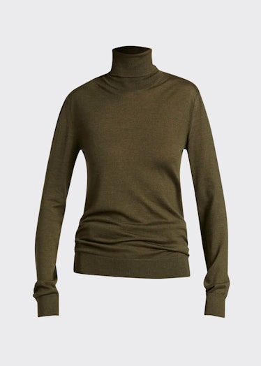 The Row's Demme cashmere olive green turtleneck sweater. 