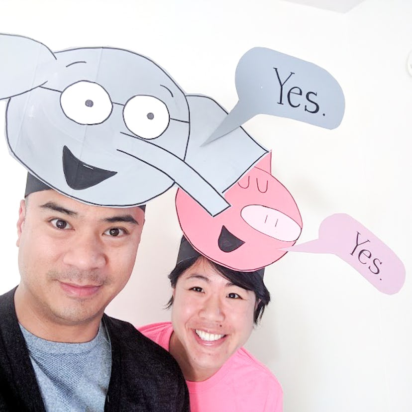 Man and woman wearing headbands of "Piggie and Elephant" characters