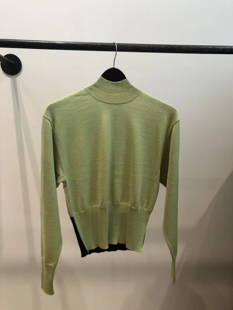 Akira Naka's color block turtleneck sweater. 