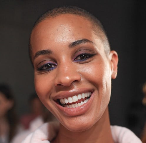 A young lady smiling with perfectly shaped and clean teeth
