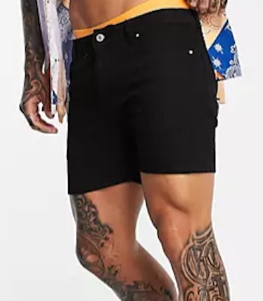 ASOS DESIGN skinny denim shorts in black in shorter length.