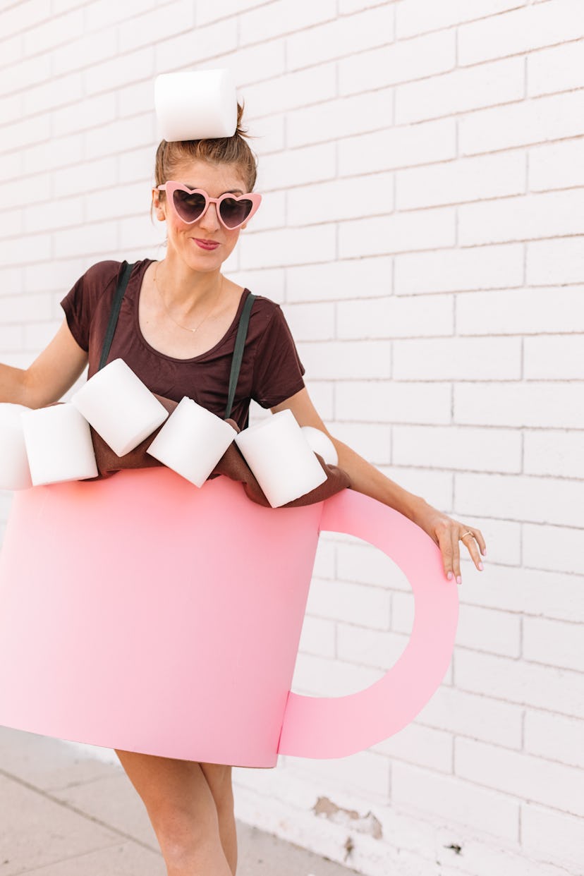 Woman wearing costume to look like a cup of hot cocoa