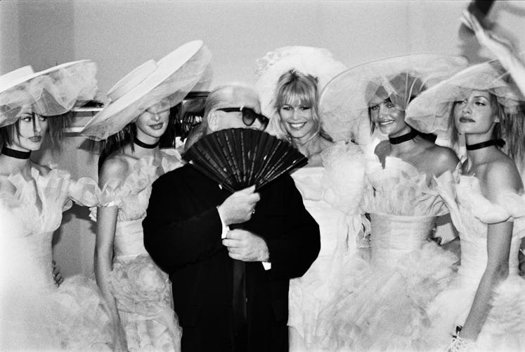 Claudia Schiffer, Karl Lagerfeld, and four other models from his Chanel show in 1994.