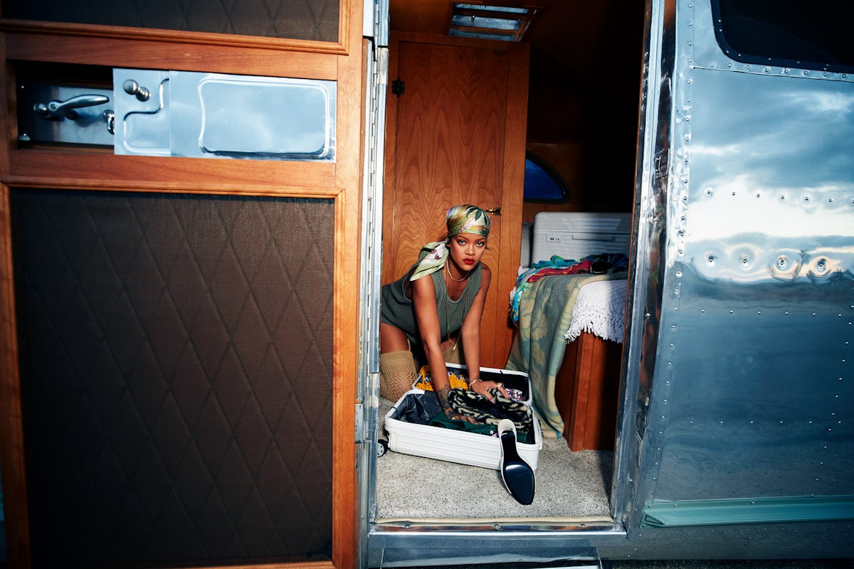 Rihanna packing a suitcase in a trailer
