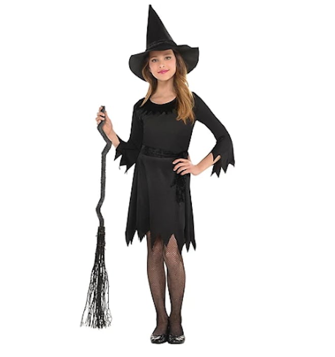 Girl wearing a witch costume
