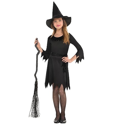 Girl wearing a witch costume