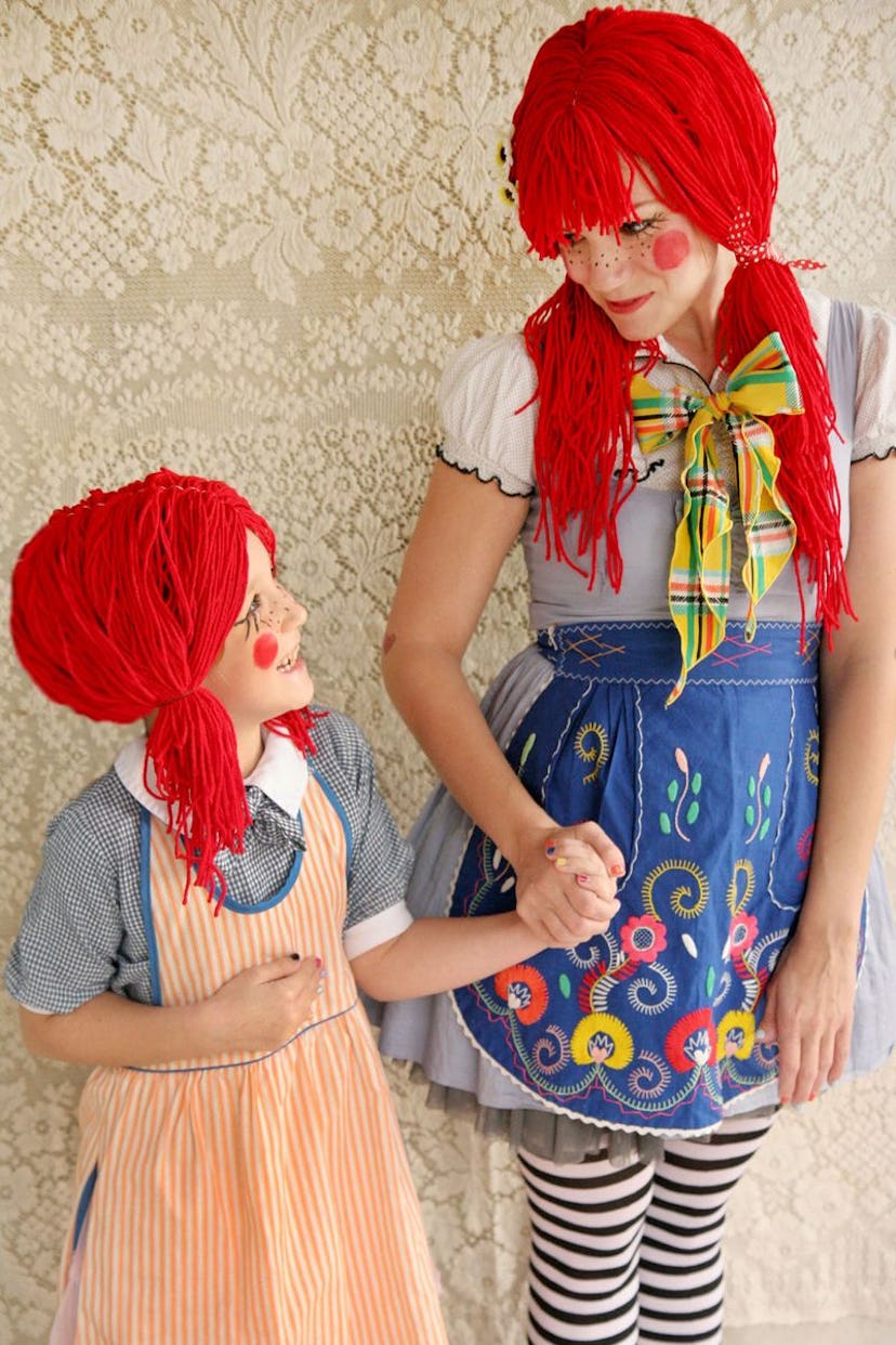 Mom and daughter, holding hands, dressed up as rag dolls
