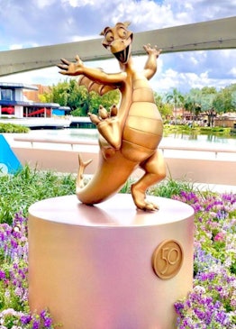 These photos of the 50th anniversary gold character statues at Disney World's Epcot are so adorable.
