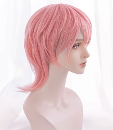 A pink, short synthetic wig with bangs