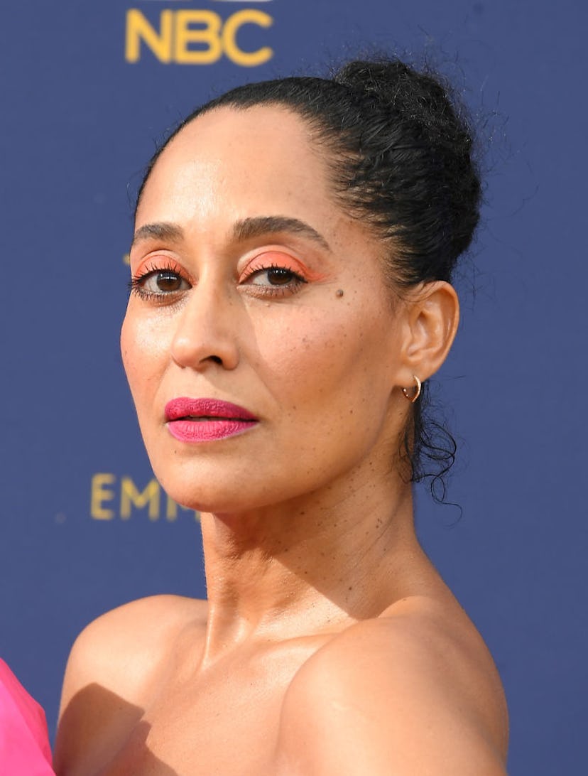 Tracee Ellis Ross wearing vivid orange eyeshadow at the 2018 Emmys.