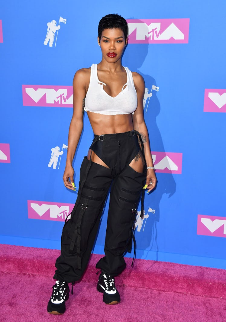 Teyana Taylor at the 2018 MTV Video Music Awards in a white top and black trousers