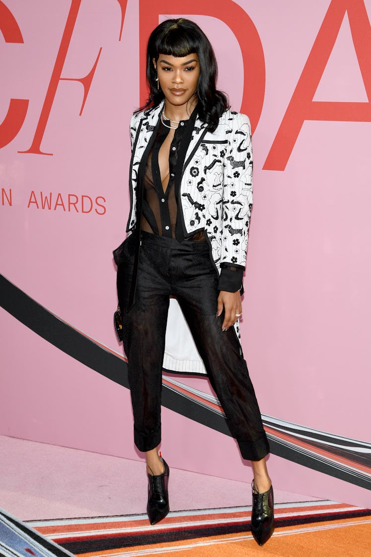 Teyana Taylor at the CFDA Fashion Awards in a white-black jacket, black shirt and trousers