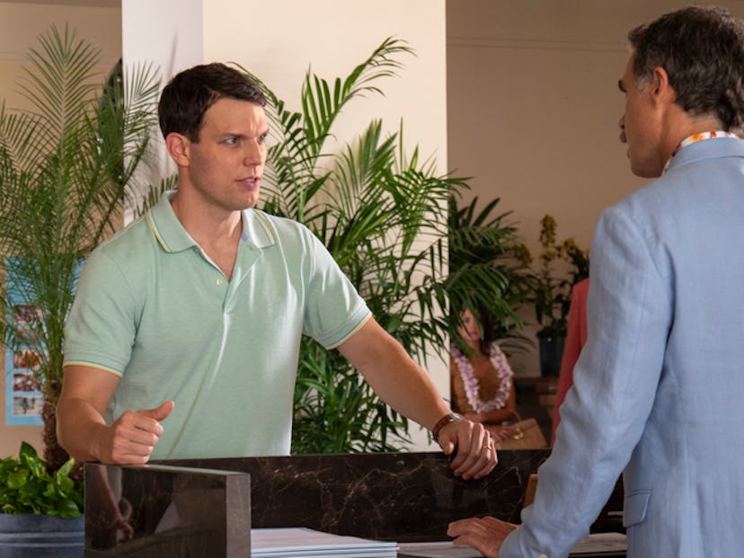 Jake Lacy plays Shane Patton on 'The White Lotus.' He is wearing a green polo shirt and staring angr...