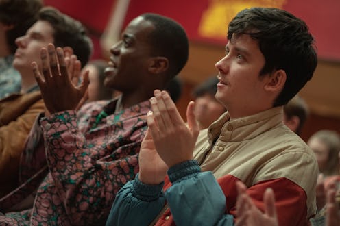 Adam, Eric, and Otis clap during assembly