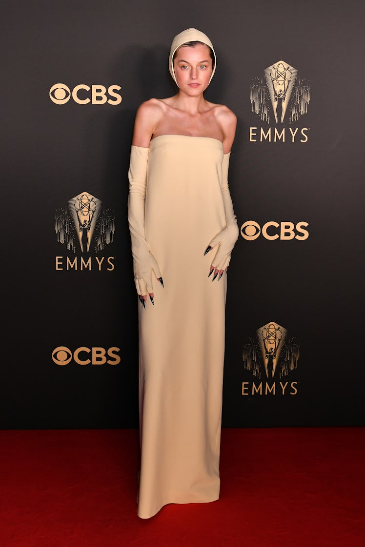 Emma Corrin in a beige Miu Miu dress at the Emmys 2021