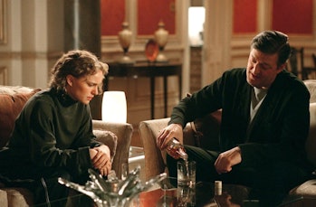 Evey (Natalie Portman) and Dietrich (Stephen Fry) share a drink in V for Vendetta.