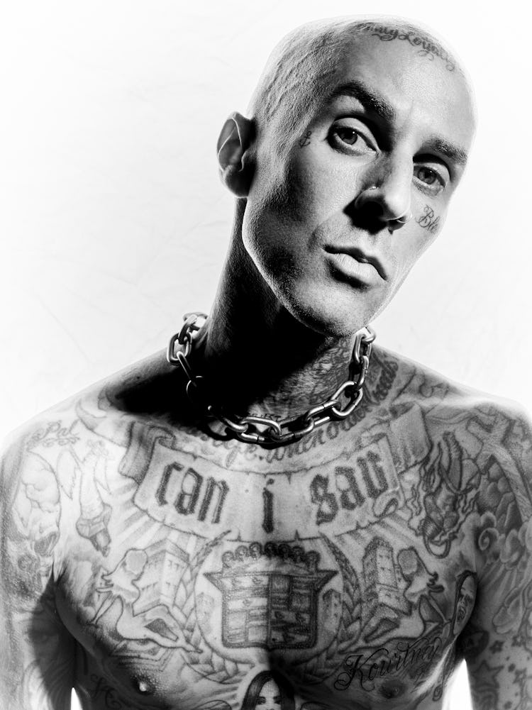 A close-up portrait of NYLON cover star Travis Barker in black and white.