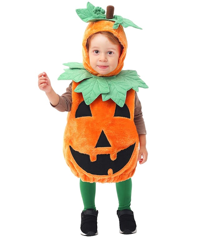 Toddler in a pumpkin costume