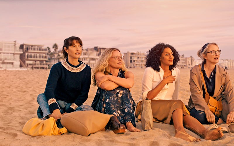Four women sit on the beach and talk in the TV show 'On The Verge.'