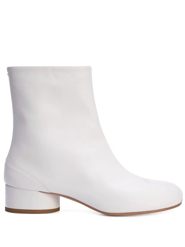 White Tabi toe ankle boot from Maison Margiela, available to shop on Farfetch.