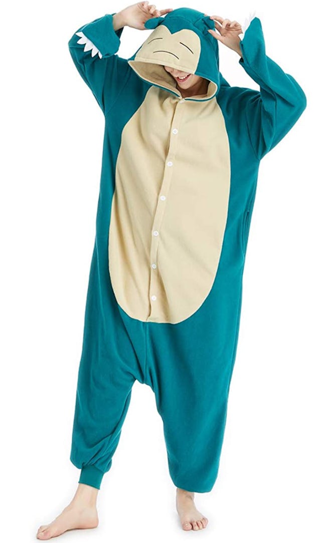 Adult posing in Snorlax onesie costume