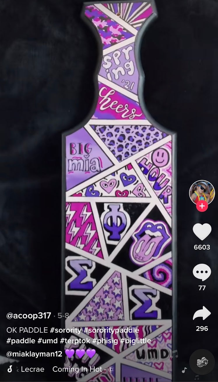 A sorority sister shows off her purple collage paddle idea on TikTok. 