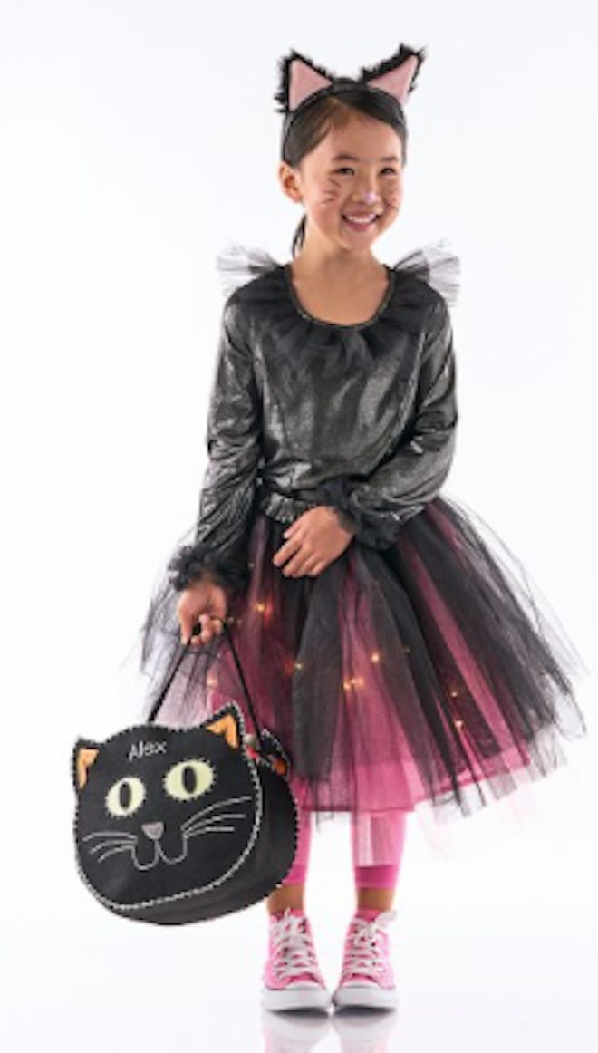 Girl wearing light up cat tutu costume