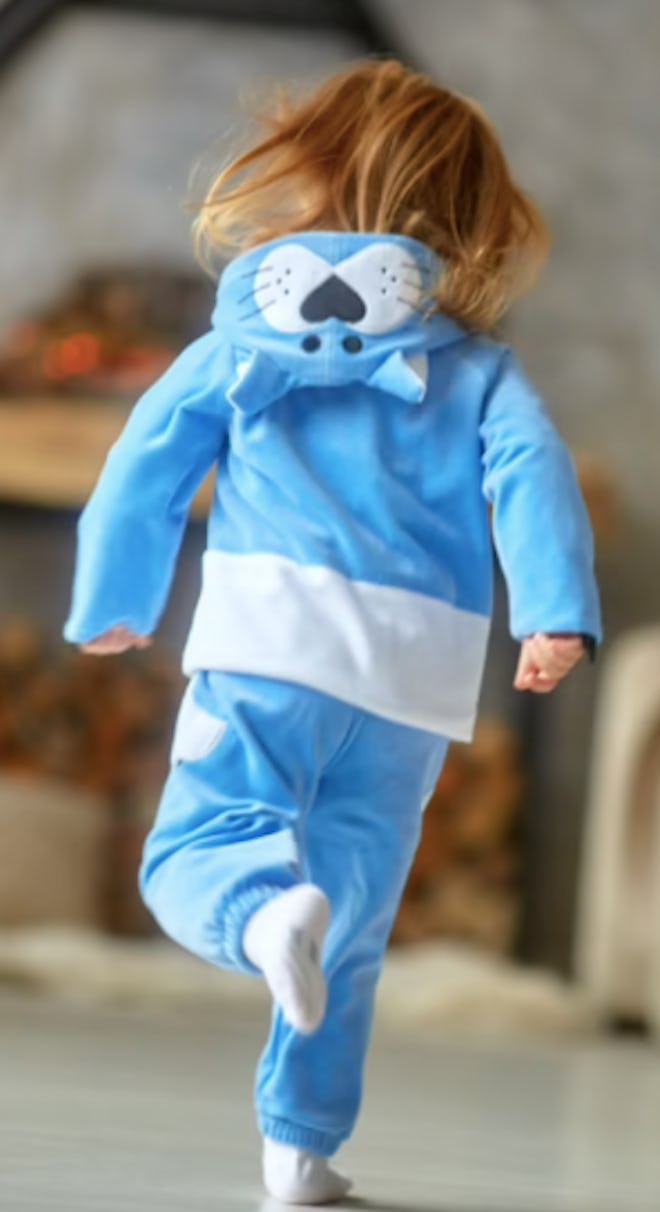 Child wearing a blue cat costume