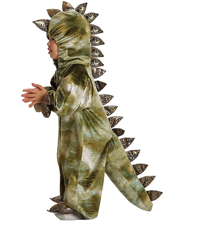 Side view of a toddler in a t-rex costume