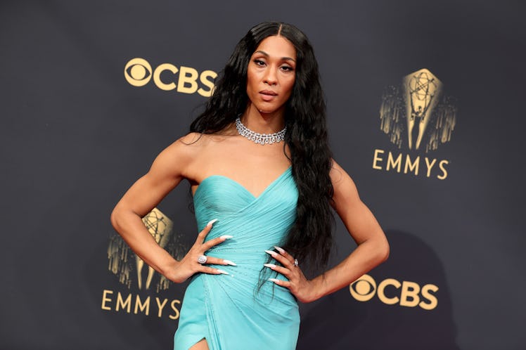 MJ Rodriguez wearing a teal Versace dress with a milky stiletto nail manicure on the Emmys 2021 red ...