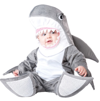 Baby wearing a shark costume