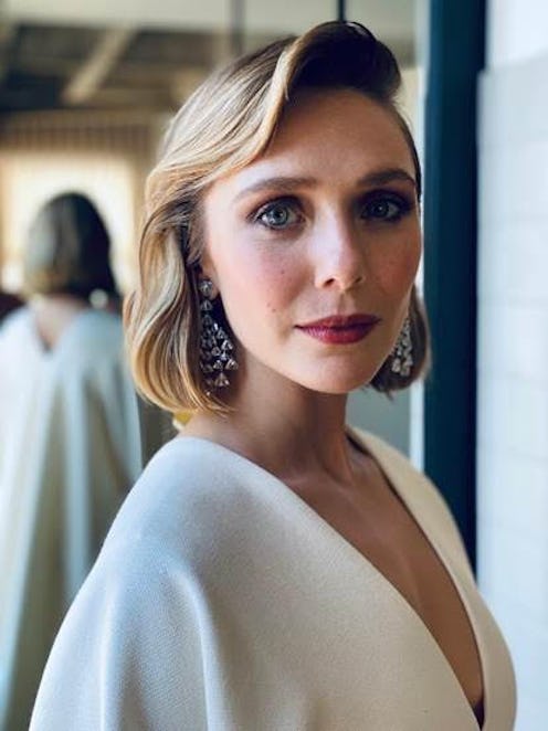 Elizabeth Olsen poses with her hair done ahead of the 2021 Emmy Awards