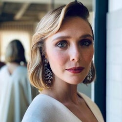 Elizabeth Olsen poses with her hair done ahead of the 2021 Emmy Awards