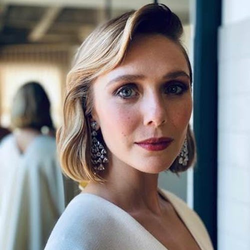 Elizabeth Olsen poses with her hair done ahead of the 2021 Emmy Awards