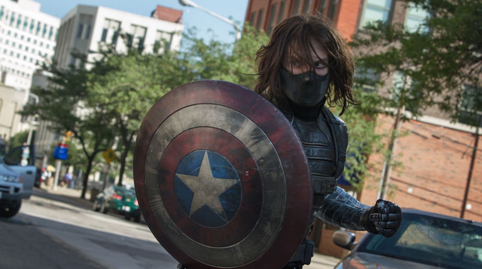 A still from &lsquo;Captain America: The Winter Soldier&rsquo; with the masked, long-haired Winter Soldier holdi&hellip;
