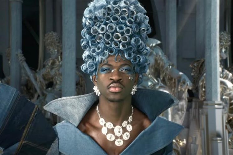 Lil Nas X in patchwork denim and a blue wig from his "Call Me By Your Name" music video.