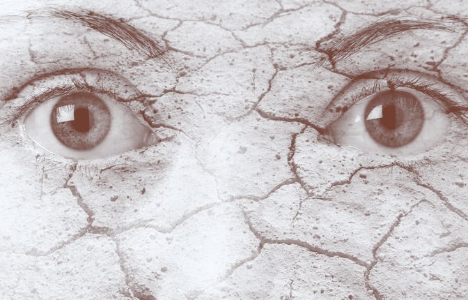 A closeup of a person's eye-area with cracked skin representing the effects climate change can have ...