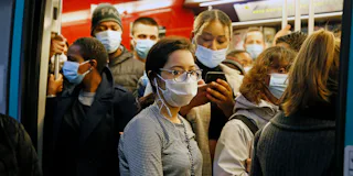 Passengers on train wear Covid-19 masks