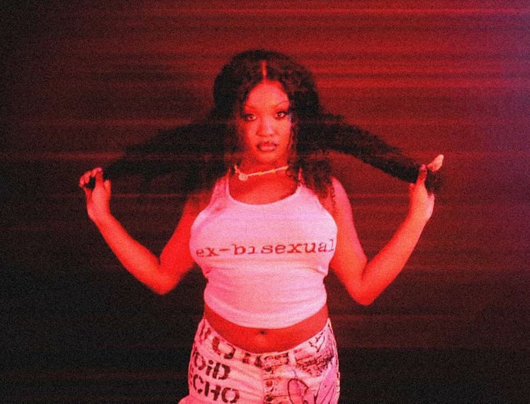 Patia Borja posing in a white tank top