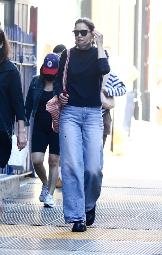 Katie Holmes wearing jeans, a sweater, Vagabond platform loafers while walking in New York City.