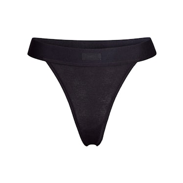 SKIMS cotton rib thong in color Soot.