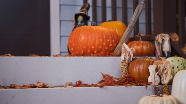 These Halloween Zoom backgrounds include a festive porch scene with pumpkins.