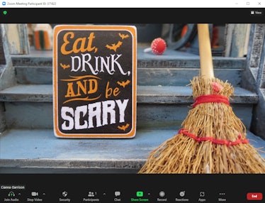 These Halloween Zoom backgrounds include an "Eat, drink, and be scary" sign.