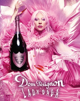 Lady Gaga in a pink gown with ruffles and a bottle of Dom Pérignon.